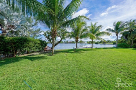 Unique Patrick’s Island Canal Front Home With Guest House And 3 Car Garage - Soon To Be Gated!